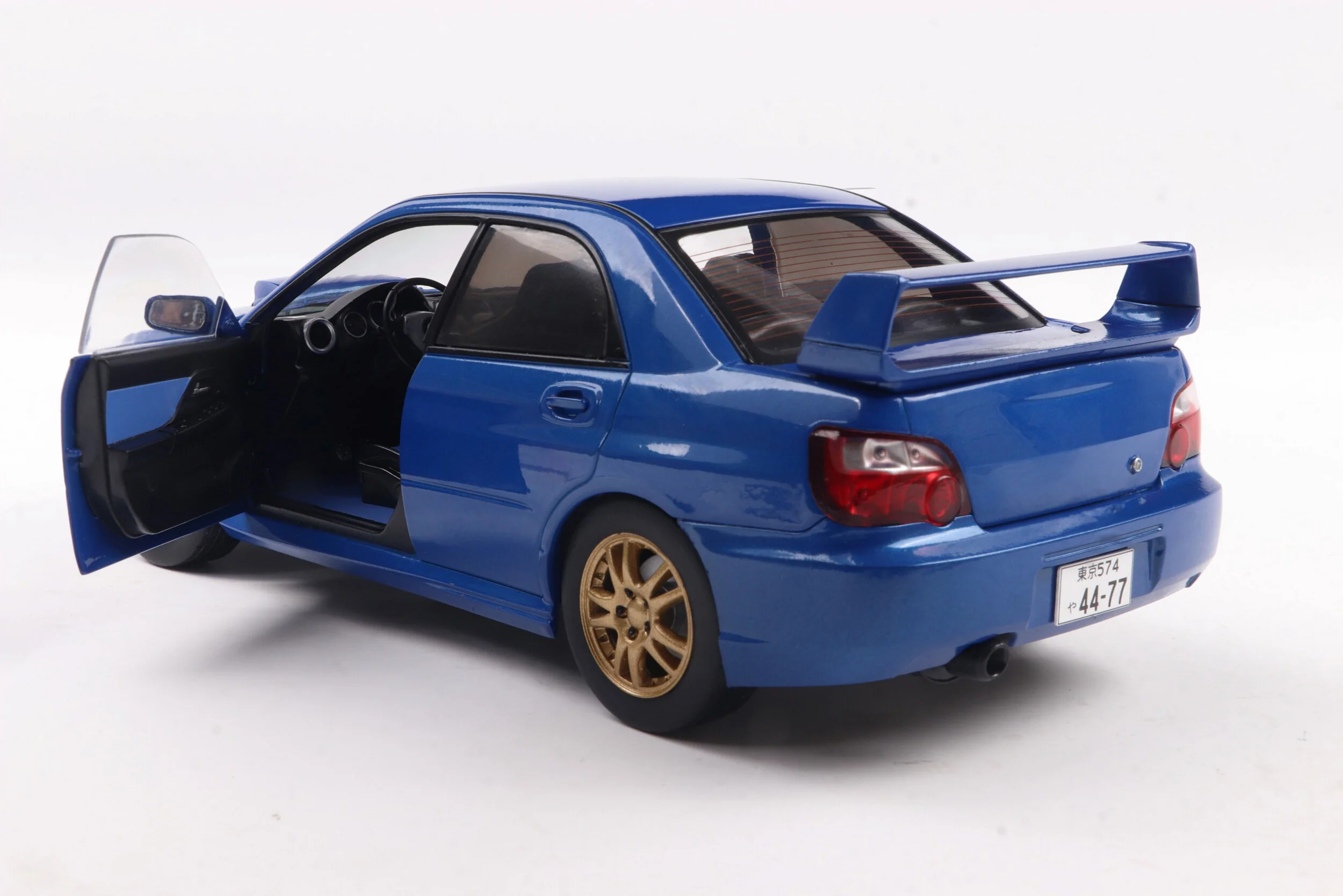 Solido 2003 Subaru WRX STi (GDB) Sonic Blue w/ Gold Wheels 1:18 - Image 6